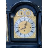 An English Triple Fusee Mantle Clock in an ebonised case and quarter striking to eight bells with