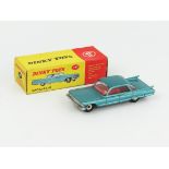 A Dinky Toys 147 Cadillac 62 in metallic green-blue, red interior and spun hubs. Near mint in in