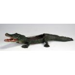 A painted bronze model of a crocodile, 22cm long.