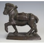 An Antique bronze pack horse, missing a cover, 11cm high.
