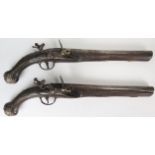 Pair of Ottoman Flintlock Pistols embellished with silver wire decoration, brass pommel and coral,