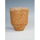 A Studio Pottery beaker with Lava glaze, impressed M mark to base, 10cm high.