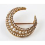 Antique Pearl and Old Cut Diamond Crescent Brooch in a high carat gold setting, largest pearl 3.5mm,