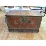 A large 19th Century Zanzibar Merchants chest with three drawers to the base, decorated with sheet