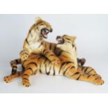 A pair of pottery Tiger cubs, made in Italy, 32cm wide approximately