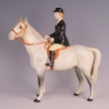 Beswick, a figure of a lady in a black jacket, black bowler hat sat on a dapple grey horse, black