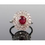 Ruby and Diamond Cluster Ring in a millegrain setting and unmarked platinum or white gold setting,