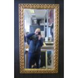 A large modern gilt frame wall mirror, composite frame with bevelled mirrored plate, overall