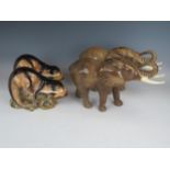 Two Sylvac Ceramics models of elephants (model 68, one with glued tusk) and two models of an Otter