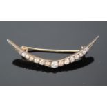 Antique Diamond Crescent Brooch set with fifteen old cut stones, largest estimated at .15ct, 45.