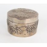 A Chinese silver dressing table box, of circular form, pull off lid, decorated with bamboo, 5x8.3cm,