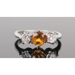 Platinum, Diamond and Yellow Sapphire Trilogy Ring, central stone c. 5mm diam., size J, 3.5g