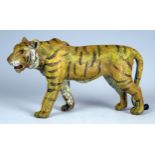 A painted bronze figure of a Tiger, 10.5cm long.