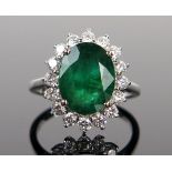 Modern 18ct White Gold, Emerald and Diamond Cluster Ring, size N, 4.6g. Central stone c. 12x9.3mm,