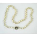16.5" Pearl Necklace with an old cut rectangular diamond clasp in a rub over setting, c. 7.5mm
