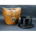 A.J. Whites leather hat box, with a Christies silk top hat.