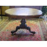 A late Victorian burr walnut circular breakfast hall table, the circular top with Kingwood cross