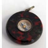 A marble compass watch fob, 2.5cm diameter.