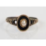 Georgian Memorial Ring with black enamel and pearl decoration in an unmarked yellow metal setting,