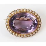 Antique Amethyst and Pearl Brooch in an unmarked high carat gold millegrain setting, central stone