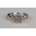 10K Rose and White Gold Multi Stone Ring, the 7mm head set with seven round cuts and further to