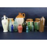 A collection of glass bottles and stoneware jars, to include a Hawkes and Sheppard, Newton Abbott