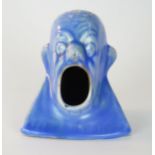 C. H. Brannam Barum, hat pin stand, in the form of a mans balled head, pale blue glaze, scripted