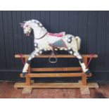A mid 20th Century wooden body rocking horse, Collinson Brothers (1836- 1990), original tack, grey