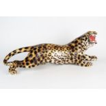 A large 20th Century Italian pottery prowling leopard, painted mark 1630/1, 63cm long.