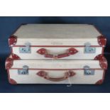 Two canvas and leather suitcases, largest 71cm wide,(2).