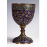 A bronze and enamel small chalice, probably Indian, 9.2cm high.