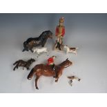 A group of 20th Century figures, to include Five Beswick figures and Officer des Hussards, (7).