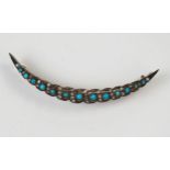 Antique Turquoise and Old Cut Diamond Crescent Brooch in an unmarked high carat gold setting,