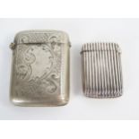 An George V silver vesta case, with reeded decoration, Birmingham 1915, 10grams, together with a