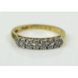 Seven Stone Diamond Ring in an 18ct gold and platinum setting, EDW 0.12ct, size I.5, 3g