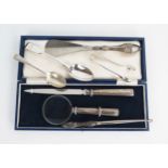 A cased paper knife and magnifying glass, together with a silver handled shoe horn, button hook,