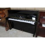 Grotrian Steinweg (c1998) A Model 116 upright piano in a bright ebonised case; together with a