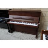 John Broadwood & Sons (c1997) An upright piano in a traditional satin mahogany case; together with a