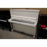 Welmar (c1994) A Model 126 upright piano in a traditional bright white case; together with a