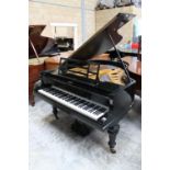 Blüthner (c1924) A 6ft 3in grand piano in an ebonised case on turned octagonal legs; together with a
