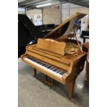 Schimmel (c1974) A 5ft grand piano in a bright walnut case on square tapered legs; together with a