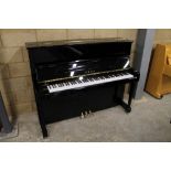 Yamaha (c2011) A Model P121 upright piano in a bright ebonised case; together with a stool.