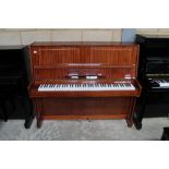 Apollo (c1976) An upright piano in a modern style bright mahogany case; together with a stool.