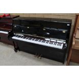 Kawai (c2005) A Model K-15E upright piano in a bright ebonised case; together with a matching stool.
