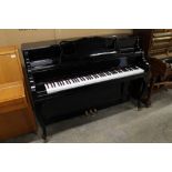 Yamaha (c1968) A Model M2 upright piano in a modern style bright ebonised case. There is VAT on this