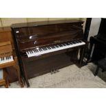 Welmar (c1988) An upright piano in a traditional bright mahogany case.