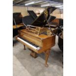 Blüthner (1905) A 6ft 3in grand piano in a rosewood case on carved and decorated cabriole legs.