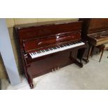 Petrof (c2002) An upright piano in a bright mahogany Chippendale style case; together with a stool.