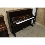 Yamaha (c2011) A Model B3 OPDW upright piano in a traditional satin mahogany case.