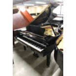 Yamaha (c1981) A 6ft 7in Model G5 grand piano in a bright ebonised case on square tapered legs;